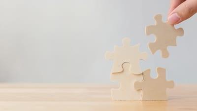 Puzzle pieces fitting together